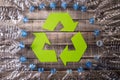 Frame of used plastic bottles with recycling symbol on wooden background. Recycle concept Royalty Free Stock Photo