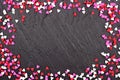 Valentines Day candy heart sprinkles frame over a black background Royalty Free Stock Photo