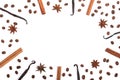 Frame of vanilla sticks, cinnamon, coffee beans and star anise on white with copy space for your text. Top view Royalty Free Stock Photo