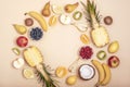 Frame of various fruits on beige background. Top view, flat lay, copy space. Tropical fruits, vegan food, healthy diet Royalty Free Stock Photo