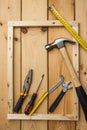 Frame with various tools on wooden background. Construction concept with copyspace Royalty Free Stock Photo