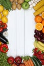Frame from vegetables and fruits like tomato, apple, orange with Royalty Free Stock Photo