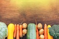 frame of Vegetables still life in wooden background with copy space top view flatlay broccoli yellow squash potatoes carrots