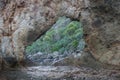 Frame view through a hole in a rock at a coast