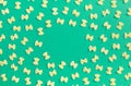 Frame from wheat pasta on green background Royalty Free Stock Photo