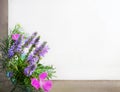 Frame of wild flowers, bell, carnation, lavender, burr, on a white canvas background. Top view, close-up. Royalty Free Stock Photo