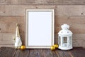 Frame on a wooden background with a gnome and a lantern Royalty Free Stock Photo