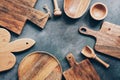 Frame wooden kitchen utensils, cutting boards, bowl, plate, mortar and pestle, scoop. Flat lay, top view,copy space