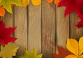 Frame from yellow autumn leaves on wooden background. Design element for poster, flyer, greeting card. Royalty Free Stock Photo