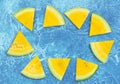 Frame of yellow watermelon on ice blue background Royalty Free Stock Photo