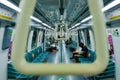 Framed capture of empty train cabin interior; shot through support hand holds; creative angle; composition