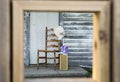 Framed old chair with suitcase Royalty Free Stock Photo