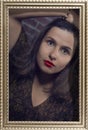 Framed portrait of lovely brunette girl with red lips and hypnotic look of big green eyes