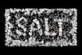 Framed SALT inscription created from sea salt and himalayan crystals on black background