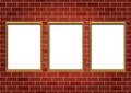 Frames for paintings or photographs on the brick wall background Royalty Free Stock Photo