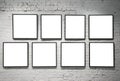 Frames on white brick wall Royalty Free Stock Photo