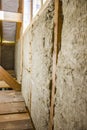 Framework of the house wall, of boards and timber, a window, a grey vapor barrier from the inside, Non-planed boards are Royalty Free Stock Photo