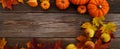 Framework with pumpkins and fall leaves on wooden background. Top view. Royalty Free Stock Photo