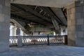 Framework under bridge. Metalwork. From the bottom of large bridge. Grey metal, modern design. Load-bearing metal Royalty Free Stock Photo