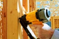 Framing contractor worker working on a small wall on a new commercial residential development