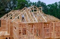 Framing structure wood frame of wooden houses home close-up new stick built home under construction under