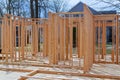 Close-up new stick built home under construction under blue sky Framing structure wood frame of wooden houses home. Royalty Free Stock Photo