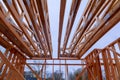 Framing of under construction wooden house building frame structure on new development Royalty Free Stock Photo