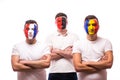 France, Albania, Romania Football fans of national teams with crossed hand look at camera Royalty Free Stock Photo