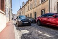 France Beaune 2019-06-19 new shiny car Mini Cooper S parking on cozy European street with paving stones. Concept travel in Europe