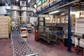 France Beaune 2019-06-20 Wine factory, production room, warehouse, shelving, shelves with boxes, empty wine bottles in package.