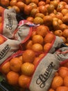 FRANCE, BORDEAUX, February, 2, 2024: Mandarin orange fruits for sale at the supermarket with one fruit peeled, Mandarin