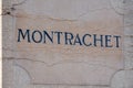 France Burgundy 2019-06-20 closeup stone pillows with vintage plate, nameboard of Montrachet grand cru vineyard