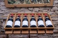 France Burgundy 2019-06-19. Wine bottles in line on wooden rack