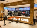 Burger King - A restaurant in the city center, empty with no people, colorful advertisements for