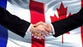 France and Canada handshake, international friendship relations, flag background