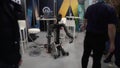 France, Cannes 18.02.24. A crowd gathers around a robot in a room, AI festival