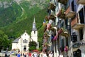 France, Chamonix Mont Blanc, August 2021: summer city with view of Alps mountains, houses decorated with flowers, people, tourists