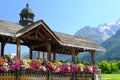 France, Chamonix Mont Blanc, August 2021: summer city with view of Alps mountains, houses decorated with flowers, people, tourists