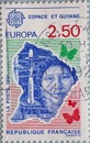 FRANCE - CIRCA 1991: a postage stamp printed in France showing a missile and portrait of a person with the country outline of Fren