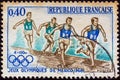 FRANCE - CIRCA 1968: A stamp printed in France from the `Olympic Games, Mexico` issue shows a 4x100 relay race, circa 1968.