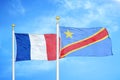 France and Congo Democratic Republic two flags on flagpoles and blue cloudy sky