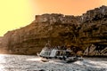 France. Corsica. Bonifacio. Ship tourists to the cliffs at dusk