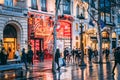 FRANCE - DECEMBER 14: People walking at the Champs Elysees at night, DECEMBER 14, 2017 in Paris, France