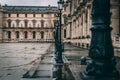 FRANCE - DECEMBER 15:  Row of antique lamps outside of the Louvre Museum, DECEMBER 15, 2017 in Paris, France Royalty Free Stock Photo