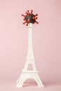France fighting against covid-19 virus abstract made of coronavirus symbol and Eiffel Tower model