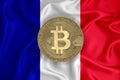 France flag, bitcoin gold coin on flag background. The concept of blockchain, bitcoin, currency decentralization in the country.