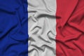 France flag is depicted on a sports cloth fabric with many folds. Sport team banner Royalty Free Stock Photo