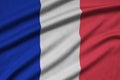 France flag is depicted on a sports cloth fabric with many folds. Sport team banner Royalty Free Stock Photo