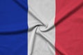 France flag is depicted on a sports cloth fabric with many folds. Sport team banner Royalty Free Stock Photo