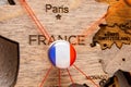 France flag on the pin with red thread showed the paths on the wooden map.